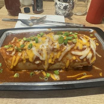 The Blue Hen Cafe - Breakfast burrito with red chile, cheddar and scallions on top. - Southern Near Me - Saint Augustine, Florida The Blue Hen Cafe - Breakfast burrito with red chile, cheddar and scallions on top. - Southern Near Me - Saint Augustine, Florida