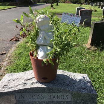 Bloomtastic Creations - Statue on top of stone - Florists Near Me - Bayonne, New Jersey