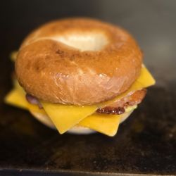 La Parrilla Cafe - Plain Bagel breakfast sandwich with cheese, and bacon.