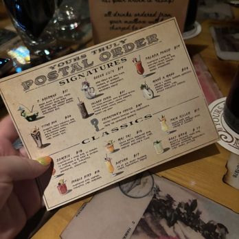 Yours Truly - The menu. My old eyes struggled to read the tiny print in the dark. I had to use my phone light. - Speakeasies Near Me - Honolulu, Hawaii