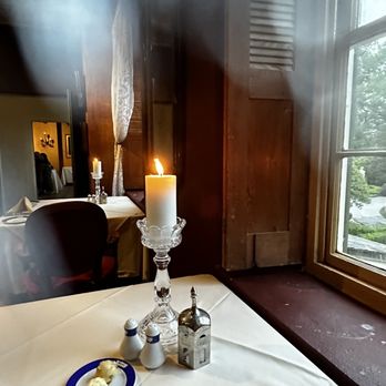 Latil's Landing Restaurant - a table with a candle, salt and pepper shakers - New American Near Me - Darrow, Louisiana