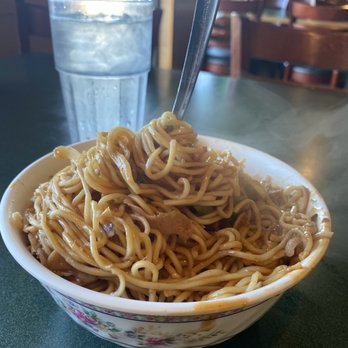 Mongolian Grill - a bowl of noodles and a glass of water - Mongolian Near Me - Rapid City, South Dakota