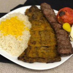 Noosh Grill Restaurant - Steak Combo (Soltani) 
Skewers of charbroiled flat fillet mignon, ground beef, Grilled tomato & onion +white rice topped w saffron