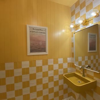 Coastal Cowboy - Women's cheerful restroom sink area - American Near Me - San Clemente, California