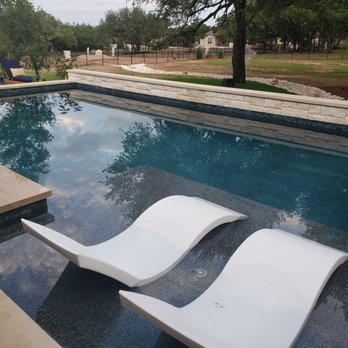 Pond Springs Custom Pools - Neal suggested the tanning deck which is great with these water loungers, with or without the fountain bubbling between them. - Pool & Hot Tub Service Near Me - Round Rock, Texas Pond Springs Custom Pools - Neal suggested the tanning deck which is great with these water loungers, with or without the fountain bubbling between them. - Pool & Hot Tub Service Near Me - Round Rock, Texas
