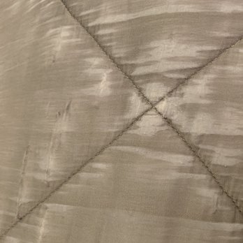 Clean Smart - Another view of the fabric pulling and tearing. The comforter is hanging on by a thread! - Dry Cleaning Near Me - Houston, Texas