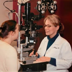 Spectacles - Dr. Rebecca Cox Patton examining a patient.