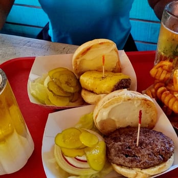 Skinny's Place - Draft Stella Artois in frosted mugs, two Skinny burgers "all the way" (one with cheese) and curly fries. Sooooo good! - Burgers Near Me - Holmes Beach, Florida Skinny's Place - Draft Stella Artois in frosted mugs, two Skinny burgers "all the way" (one with cheese) and curly fries. Sooooo good! - Burgers Near Me - Holmes Beach, Florida