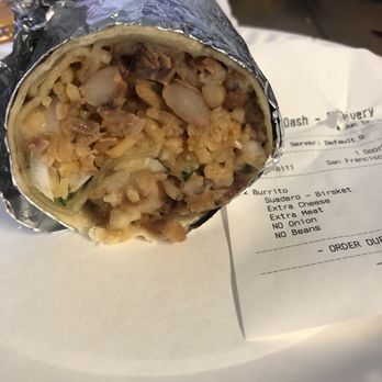 TacoMania - Suadero burrito full of beans and onions. Notice the receipt. - Food Trucks Near Me - Santa Clara, California TacoMania - Suadero burrito full of beans and onions. Notice the receipt. - Food Trucks Near Me - Santa Clara, California