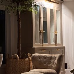 TrueGrain - Brass cremone bolts, pulls and picture light against the perfect creamy taupe.
