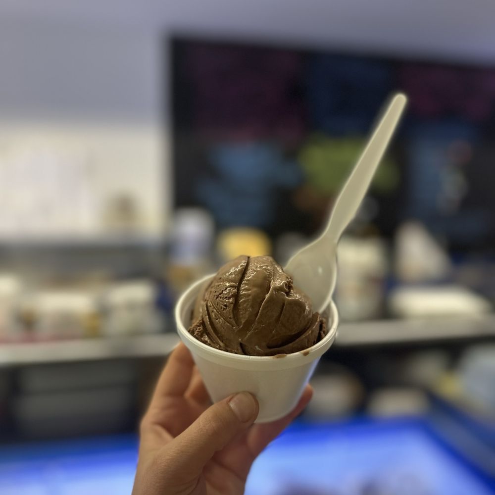 Scoops Ice Cream - a hand holding a cup of ice cream - Ice Cream & Frozen Yogurt Near Me - Mocksville, North Carolina Scoops Ice Cream - a hand holding a cup of ice cream - Ice Cream & Frozen Yogurt Near Me - Mocksville, North Carolina