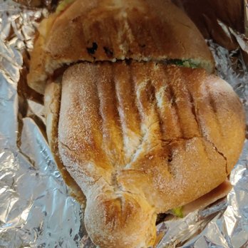 Caldense & Bakery - a sandwich wrapped in tin foil - Bakeries Near Me - Toronto, Ontario