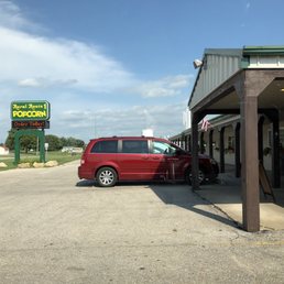 a red van parked in front of a restaurant a red van parked in front of a restaurant