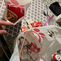 ows a person grabbing a bag of food