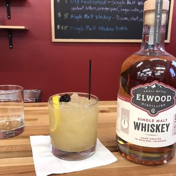 Elwood Distilling - a glass of whiskey and a bottle of whiskey - Distilleries Near Me - Boulder, Colorado Elwood Distilling - a glass of whiskey and a bottle of whiskey - Distilleries Near Me - Boulder, Colorado