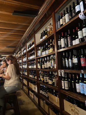 Photo of El Carajo International Tapas & Wines - Miami, FL, US. A wall FULL of wine to choose from!