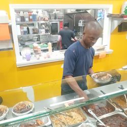 He's serving the food from us