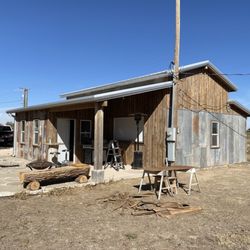 Enns Construction - Rustic metal and wood siding for a mancave
