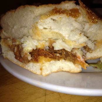 Benders Tavern - BBQ Sandwich ith slaw - very, very thin layer of very sweet pork, and an even thinner layer of a strange tasting slaw. - Bars Near Me - Greensboro, North Carolina Benders Tavern - BBQ Sandwich ith slaw - very, very thin layer of very sweet pork, and an even thinner layer of a strange tasting slaw. - Bars Near Me - Greensboro, North Carolina