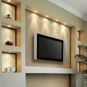 All American Team - a living room with a fireplace and tv - Plumbing Near Me - Temecula, California
