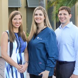 Pelican Landing Dental - Drs. Lacy and Rich Gilbert with Pelican Landing Dental's Office Manager, Ashley