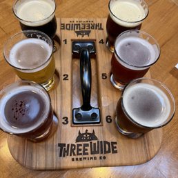 Beer flight. I split this with my husband but I then ordered a small pour of my very favorite that I sampled. Beer flight. I split this with my husband but I then ordered a small pour of my very favorite that I sampled.