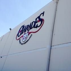 Charades - Building signage where the front entrance is