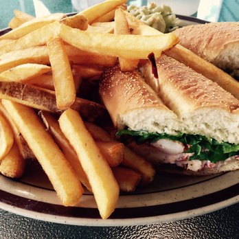 The Seagull Restaurant - Lobster roll sandwich with coleslaw & fries -big chunks of lobster meat not overpowered by mayo. - Seafood Near Me - Ingonish, Nova Scotia