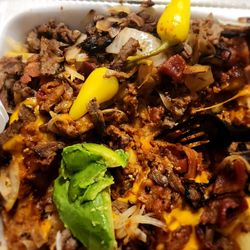 Tom's Famous Burgers - This is chili cheese steak fries with bacon, grilled onions, Peppers and avocados