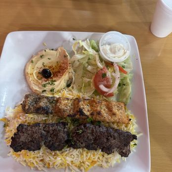 Taj Ali - Shush kabob- one chicken, one beef. The beef has lamb in it. Served with hummus, lettuce and garlic sauce. - Middle Eastern Near Me - Lincoln, Nebraska Taj Ali - Shush kabob- one chicken, one beef. The beef has lamb in it. Served with hummus, lettuce and garlic sauce. - Middle Eastern Near Me - Lincoln, Nebraska