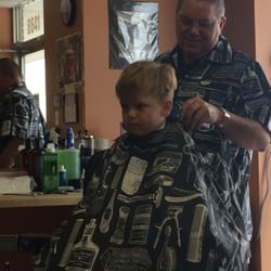 Peter's Place For Hair - Peter is shown here. He's the owner and is cutting my son's hair in this one.