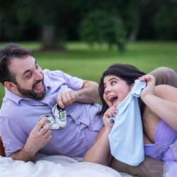 Nakita the Photographer - Romantic picnic moment captured during outdoor maternity photography.