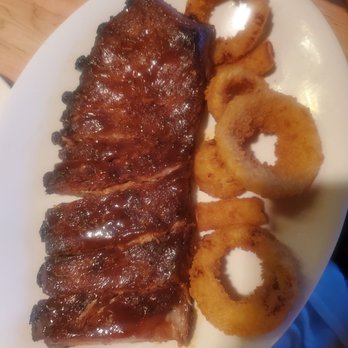 E.G. Nick's Grill & Tavern - E.G. Famous BBQ Ribs with onion rings - Greek Near Me - Lapeer, Michigan E.G. Nick's Grill & Tavern - E.G. Famous BBQ Ribs with onion rings - Greek Near Me - Lapeer, Michigan