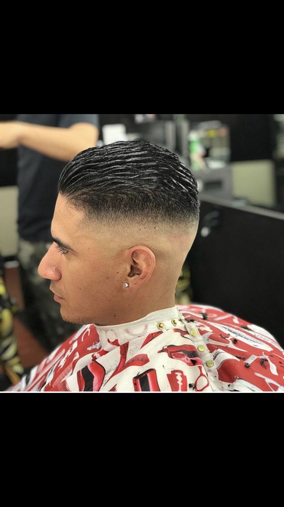 Skittlez House Barbershop Logo