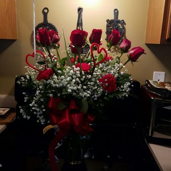 Bland's Florist - A dozen roses with carnations and baby's breath. - Florists Near Me - Petersburg, Virginia
