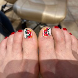 Saloni Nails & Spa - Christmas pedicure, with poinsettias on my big toe nails. So pretty!