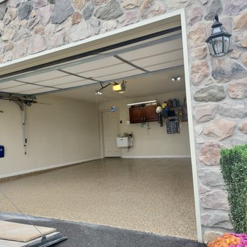 Floortek & More - a garage with a stone wall - Flooring Near Me - Highspire, Pennsylvania