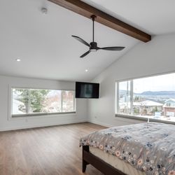 Vancouver General Contractors - Luxury primary bedroom suite renovation with vaulted ceilings in Westmount by Vancouver General Contractors.