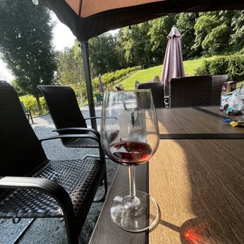 Royal Rabbit Vineyard - a glass of wine on a patio table - Wineries Near Me - Parkton, Maryland