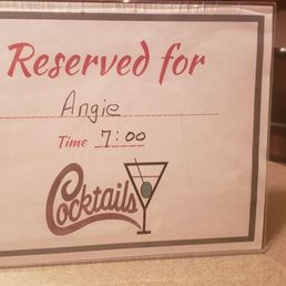 a reserved sign for a drink