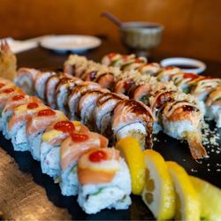 Nami Sushi - 4 roll combo- The Firebird (second roll to the left) with black pepper sauce is the best!