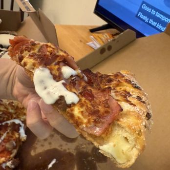 Domino's Pizza - Slice of meats pizza with a cheesy crusts edge - Pizza Near Me - Burnaby, British Columbia