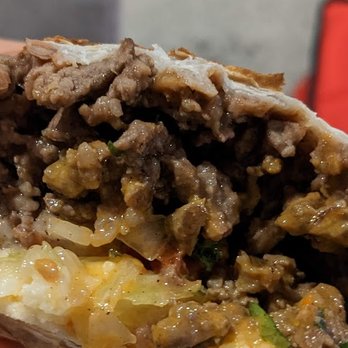 Tacos Yanga - Asada burrito, cross section. Good amount of meat. - Tacos Near Me - Grand Rapids, Michigan Tacos Yanga - Asada burrito, cross section. Good amount of meat. - Tacos Near Me - Grand Rapids, Michigan