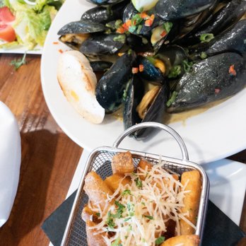 Next Door Beach Bistro - Mussels and fries (Thai coconut sauce) - Seafood Near Me - Flagler Beach, Florida Next Door Beach Bistro - Mussels and fries (Thai coconut sauce) - Seafood Near Me - Flagler Beach, Florida