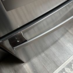 Photos are the cracked countertop and freezer handle upside down and pointing at the striped screw head