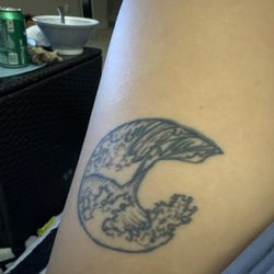 Santa Cruz Tattoo - Raised scars around the edges. Top right. Thick lines. Ouch
