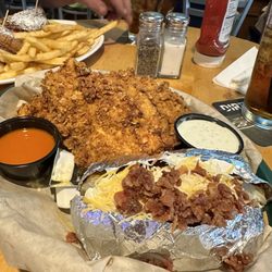 Noonan's Sports Bar & Grill - Chicken tenders and loaded baked potato