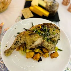 Herb roasted half chicken citrus jus with blistered green beans roasted walnuts and roasted baby squash medley