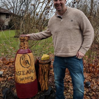 Rustic Acres Winery - a man standing next to a bottle of wine - Wineries Near Me - Butler, Pennsylvania Rustic Acres Winery - a man standing next to a bottle of wine - Wineries Near Me - Butler, Pennsylvania
