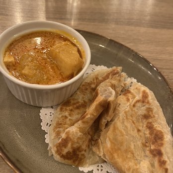Mamak - The appetizer Roti Canai Flavorful curry consistency with some chicken and potatoes with naan bread. - Malaysian Near Me - Doraville, Georgia Mamak - The appetizer Roti Canai Flavorful curry consistency with some chicken and potatoes with naan bread. - Malaysian Near Me - Doraville, Georgia